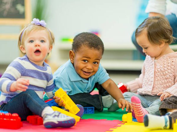 Diverse group of babies playing.